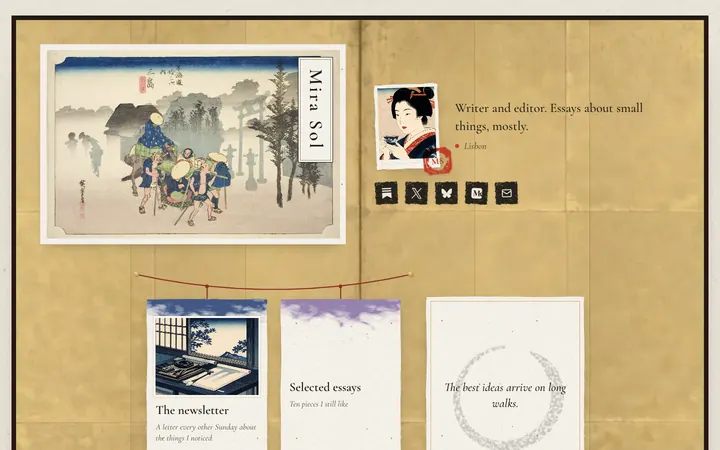 A Washi page on a gold folding screen, with a Hiroshige print bearing the name Mira Sol, a portrait with a red seal and paper cards for a newsletter and essays